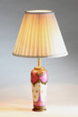 A GILT METAL MOUNTED LIMOGES PORCELAIN VASE, ADAPTED AS A TABLE LAMP