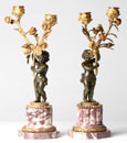 A PAIR OF FRENCH BRONZE AND ORMOLU FIGURAL CANDELABRA, IN LOUIS XVI STYLE