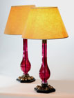 A PAIR OF TALL LUCY COPE BRASS MOUNTED CUT RUBY (SULTAN’S RED) GLASS TABLE LAMPS