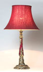 A TALL VICTORIAN BRASS MOUNTED CERAMIC OIL LAMP BASE, FITTED FOR ELECTRIC LIGHT