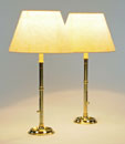 A PAIR OF GEORGE III TALL BRASS EJECTOR CANDLESTICKS, <br>ADAPTED AS TABLE LAMPS