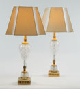 A PAIR OF AMERICAN GILT MOUNTED CUT GLASS TABLE LAMPS